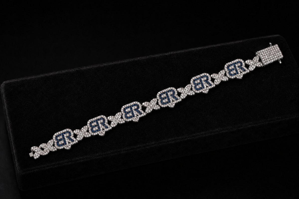 Blue BR monogram bracelet displayed on a black jewelry box.