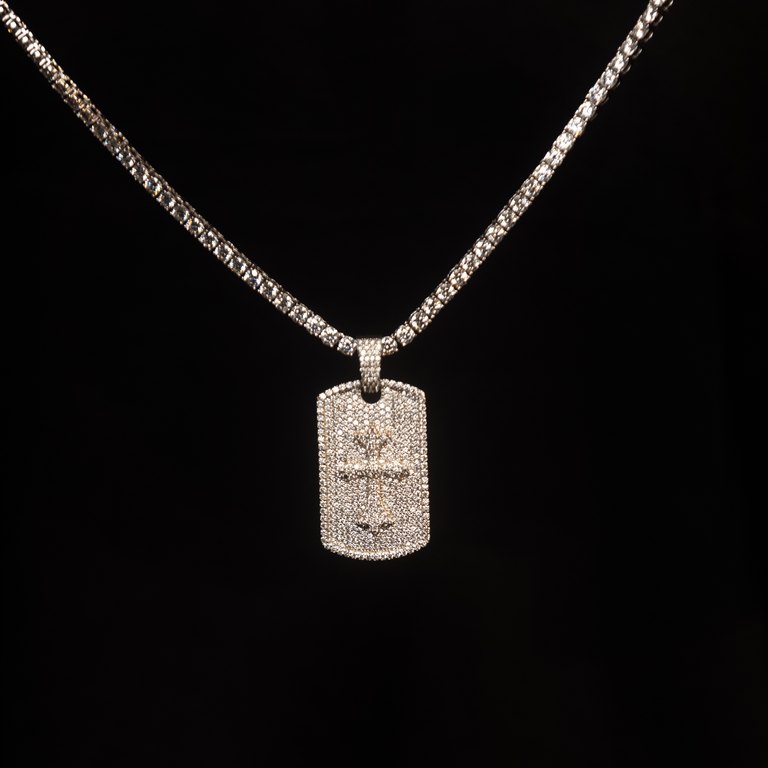 Diamond chain with a rectangular pendant against black.