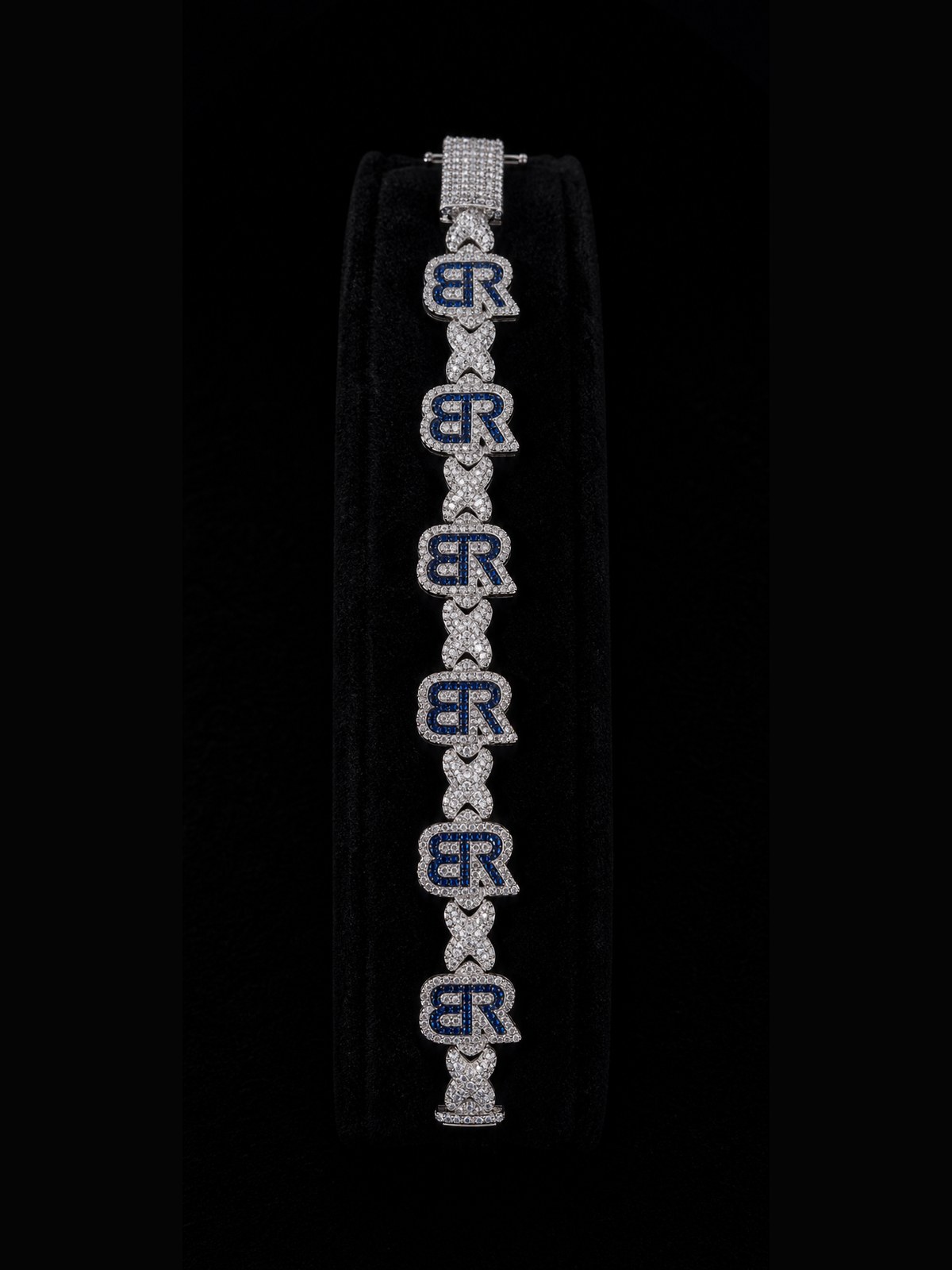 Blue BR monogram bracelet displayed on black velvet.