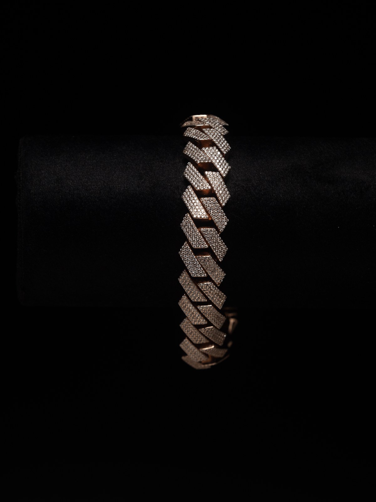 Diamond-set link bracelet photographed against black velvet.